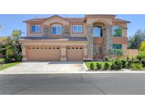 Spacious two-story home with a three-car garage and stone accents at 281 Powerbilt Ave, Las Vegas, NV 89148