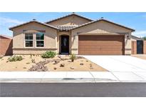 Charming single-story home with desert landscaping, neutral tones, and a two-car garage, perfect for curb appeal at 3966 E Garfield Dr, Pahrump, NV 89061