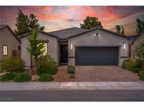 Charming single-story home featuring a two-car garage, brick driveway, and well-manicured landscaping at 4356 E Cactus Canyon Dr, Pahrump, NV 89061
