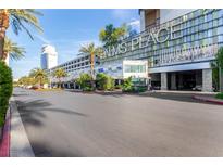 A view of the Palms Place entrance with palm trees in front of the hotel at 4381 W Flamingo Rd # 18320, Las Vegas, NV 89103