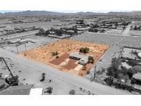 Sprawling desert property featuring a well-maintained single-story home and ample land at 5085 Raven Ave, Las Vegas, NV 89139