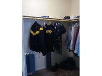 This walk-in closet offers ample storage with rods and a shelf, perfect for organization at 5852 Clear Haven Ln, North Las Vegas, NV 89081