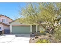 Charming single-story home featuring a well-kept yard and a two-car garage with mature landscaping at 8337 Willow Basin Ct, Las Vegas, NV 89131