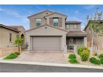 Charming two-story home featuring a neutral color palette, tiled roof, two-car garage, and well-maintained landscaping at 8801 Trotternish Ridge Dr, Las Vegas, NV 89166