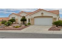 Charming one-story home with a two-car garage and desert landscaping at 10513 Longwood Dr, Las Vegas, NV 89134
