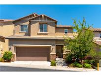 Charming two-story home with a two-car garage and desert landscaping at 10750 Red Badge Ave, Las Vegas, NV 89166
