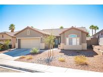 Charming single-story home featuring a two-car garage and low maintenance desert landscaping at 11119 River Hills Ln, Las Vegas, NV 89135