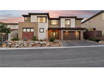 Beautiful two-story home showcasing modern architecture, neutral colors, and a well-manicured front yard at 12155 Sage Thunder Ave, Las Vegas, NV 89138
