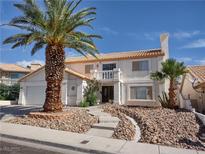 Charming two-story home with well-maintained landscaping and mature palm trees at 1538 Pony Ranch Cir, Henderson, NV 89014