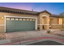 Inviting home featuring a neatly kept yard, charming curb appeal, and a convenient two-car garage at 2213 Chandler Ranch Pl, Laughlin, NV 89029