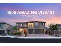 Beautiful two-story home with manicured landscaping and a three-car garage in a desirable neighborhood at 4505 Amazing View St, Las Vegas, NV 89129