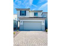 Charming two-story home with a two-car garage and a well-maintained paver driveway, creating a welcoming curb appeal at 4505 Hidden Stone Ave, Las Vegas, NV 89141