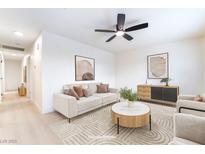 Bright living room featuring a neutral color palette, modern furnishings, and stylish decor at 50 Armstrong Cir, Henderson, NV 89015