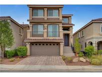 Charming three-story home with a two-car garage and well-manicured landscaping at 6056 Atlantis Dream Ave, Las Vegas, NV 89139