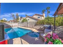 Sparkling pool and spa with patio area perfect for outdoor entertaining and lounging under the sun at 6408 Deadwood Rd, Las Vegas, NV 89108