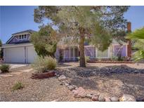 Charming single-story home with desert landscaping and mature trees at 6773 Obannon Dr, Las Vegas, NV 89146