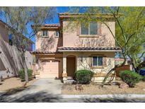 Charming two-story home with desert landscaping, attached garage, and stucco exterior at 8396 Pearl Beach Ct, Las Vegas, NV 89139