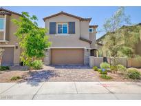 Charming two-story home with a two-car garage, desert landscaping, and neutral color scheme at 8873 Howell St, Las Vegas, NV 89166