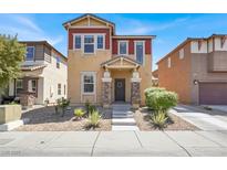 Charming two-story home featuring manicured landscaping and a welcoming front porch at 992 Wagner Valley St, Henderson, NV 89052