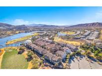 Breathtaking aerial view of lakeside homes and golf course, with mountains in the backdrop at 1 Corte Belleza, Henderson, NV 89011