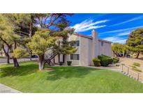 Inviting apartment complex with lush lawn and mature trees offering ground level and upper level units at 1316 Capri Dr # Abc&D, Boulder City, NV 89005