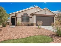 Charming home with desert landscaping, stone accents, and a two-car garage at 2860 Galena Peak Ln, Las Vegas, NV 89156