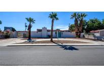 Modern home features desert landscaping, white brick exterior and palm tree accents at 3368 Seneca Dr, Las Vegas, NV 89169