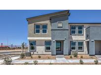 Modern two-story home featuring a stylish two-tone exterior, well-manicured landscaping, and ample natural light at 6105 Aster Garden St # 160, North Las Vegas, NV 89081