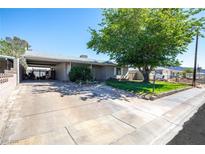 Quaint single story home with a carport and mature shade tree at 7 Sturm St, Henderson, NV 89015