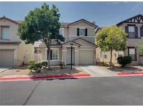 Two-story home featuring manicured landscaping and an attached garage at 7257 Early Pioneer Ave, Las Vegas, NV 89129