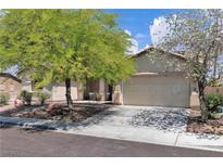Charming single-story home featuring a well-maintained yard and a two-car garage at 7870 Midnight Ride St, Las Vegas, NV 89131