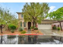 Charming two-story home with a well-maintained yard and a two-car garage at 9893 Santa Ponsa Ct, Las Vegas, NV 89178