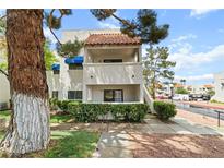 Condo with stucco exterior, tile roof, and charming balcony at 101 Luna Way # 222, Las Vegas, NV 89145