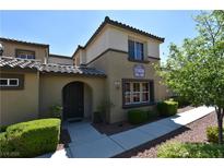 Inviting home featuring a well-maintained lawn, arched entryway and clearly displayed address number at 11416 Belmont Lake Dr # 102, Las Vegas, NV 89135