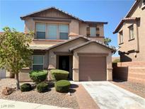 Charming two-story home with a well-maintained yard and inviting curb appeal in a residential neighborhood at 1152 Paradise Desert Ave, Henderson, NV 89002