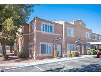 Charming two-story townhome featuring a well-maintained exterior and nicely landscaped front yard at 2166 Sleepy Ct, Las Vegas, NV 89106