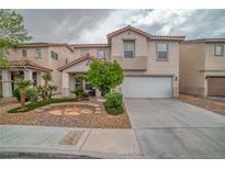 Charming two-story home featuring a well-manicured front yard and attached two-car garage at 5021 Apache Valley Ave, Las Vegas, NV 89131