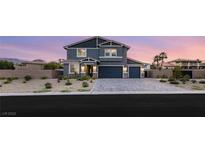 Beautiful two-story home featuring a well-manicured front yard and a two-car garage at 5449 Hickory Tree St, Las Vegas, NV 89149