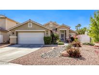 Charming single-story home featuring a well-maintained landscape, gravel yard, and a two-car garage at 6021 Winter Meadow St, Las Vegas, NV 89130