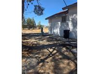 View of the backyard, showing the side of the property at 626 Kimberly Ave, Pahrump, NV 89060