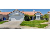Charming single story home with well manicured lawn and desert landscaping at 6432 Jean Lee Dr, Las Vegas, NV 89108