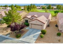Inviting single-story home with a well-manicured yard and charming desert landscaping at 7509 Chaffinch St, North Las Vegas, NV 89084