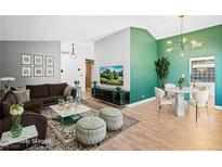 Bright living room with modern decor, stylish furniture, and decorative wall art and fixtures at 1655 E Hacienda Ave, Las Vegas, NV 89119