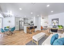 Bright, open-concept living space with modern kitchen, dining area, and stylish decor at 3104 Waterview Dr, Las Vegas, NV 89117