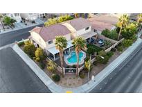 Gorgeous aerial view of a home with a pristine pool and well-manicured landscaping in a desirable neighborhood at 3194 Lapis Beach Dr, Las Vegas, NV 89117