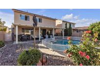 Beautiful backyard pool and patio area with mature landscaping, ideal for outdoor entertaining at 3194 Lapis Beach Dr, Las Vegas, NV 89117