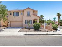 Charming two-story home with a two-car garage, desert landscaping, and a red tile roof at 3194 Lapis Beach Dr, Las Vegas, NV 89117