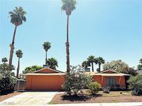 Charming single-story home with desert landscaping and mature palm trees in a sunny setting at 3855 Mayhill Ave, Las Vegas, NV 89121