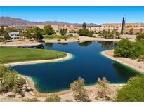 Scenic view of a lush community pond and its surrounding landscape of the Painted Desert golf course in Las Vegas at 4821 Black Bear Rd # 101, Las Vegas, NV 89149