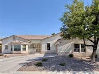 Charming single-story home featuring desert landscaping, a bay window, and a private courtyard at 5422 Nestled Moon Ct, Las Vegas, NV 89131